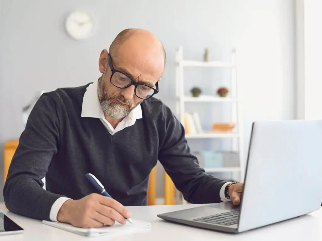 Driver completing Online Driver CPC Course UK on a laptop